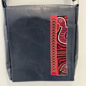 Handmade, artisanal crossbody bag.